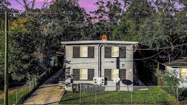 view of front of property with a yard