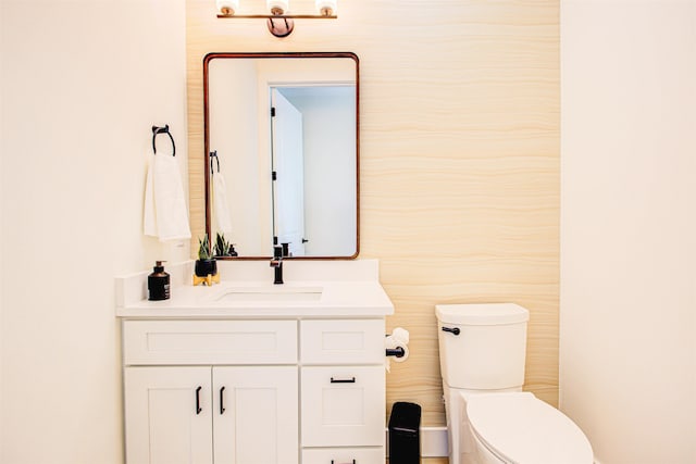 bathroom with vanity and toilet