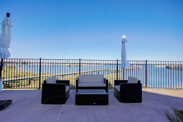 view of patio / terrace featuring an outdoor living space and a water view