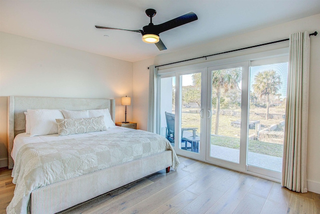 bedroom featuring access to exterior, light hardwood / wood-style flooring, french doors, and ceiling fan