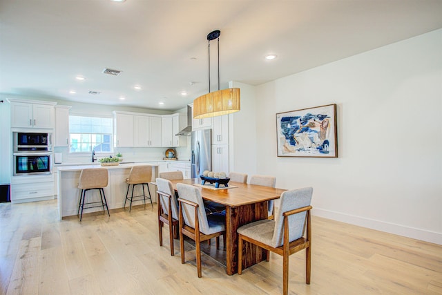 dining room featuring light hardwood / wood-style floors