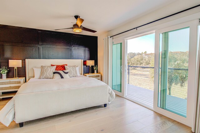 bedroom featuring light wood-type flooring, access to exterior, and ceiling fan