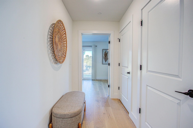 hall with light hardwood / wood-style floors