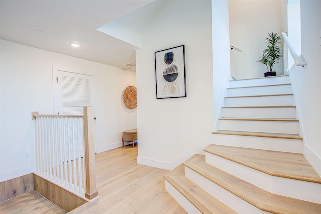 staircase featuring hardwood / wood-style flooring