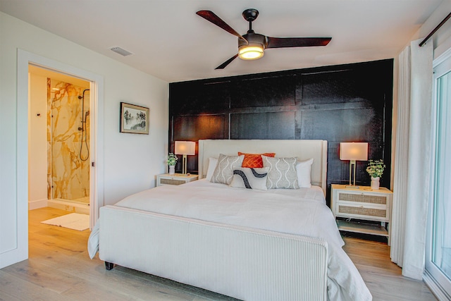 bedroom featuring ceiling fan, connected bathroom, and light wood-type flooring