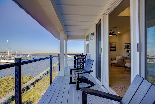 balcony featuring a water view