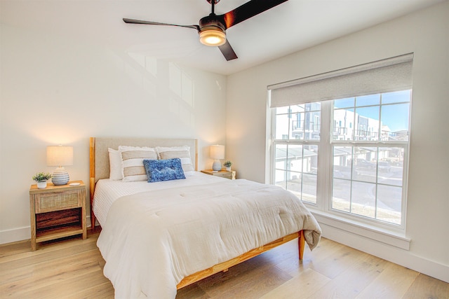 bedroom featuring ceiling fan and light hardwood / wood-style floors