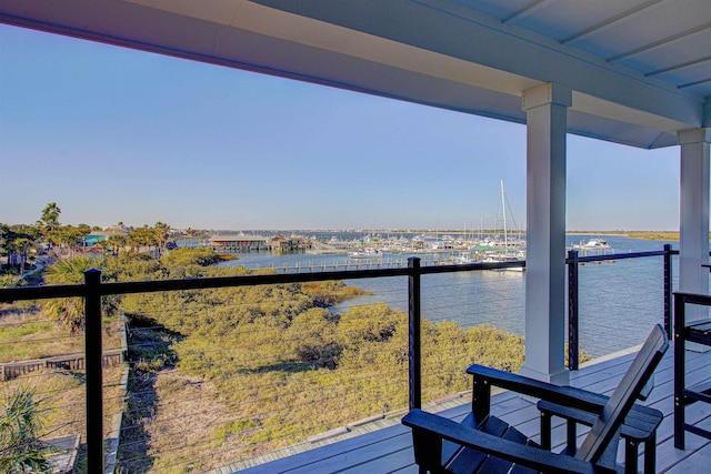 balcony featuring a water view