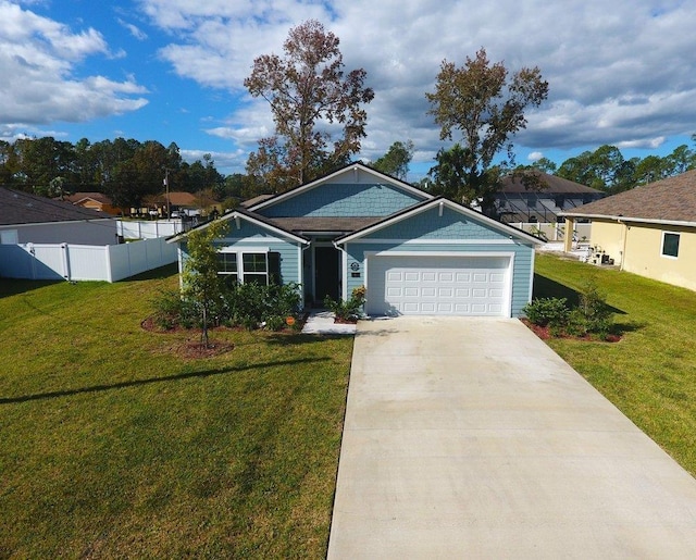 view of front of home featuring a garage and a front yard