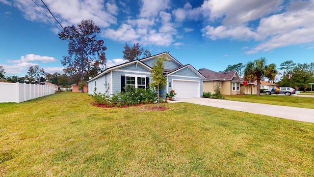 view of front of house with a garage and a front yard