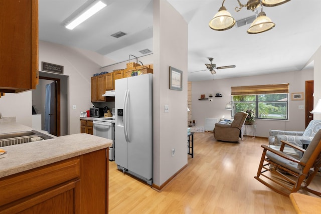 424 Orchis Rd, Saint Augustine, FL 32086 - kitchen featuring white appliances, open floor plan, light wood-style floors, light countertops, and ceiling fan
