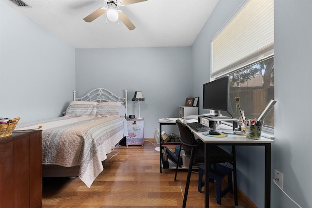 424 Orchis Rd, Saint Augustine, FL 32086 - bedroom with a desk, wood finished floors, and a ceiling fan
