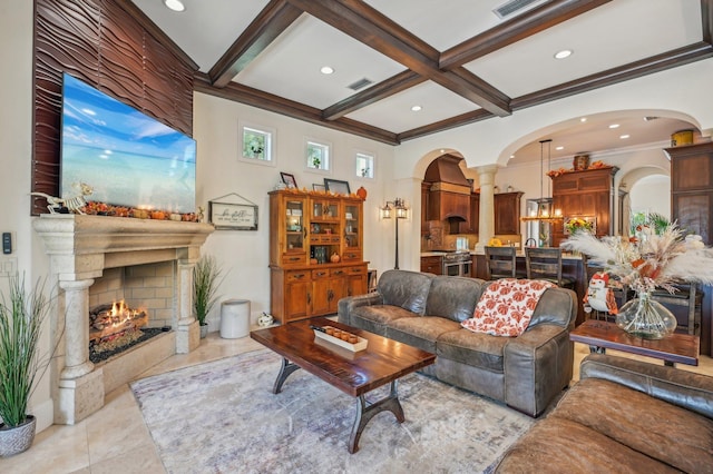 living room with beam ceiling, crown molding, light tile patterned floors, and coffered ceiling