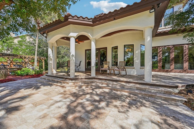 view of patio with ceiling fan