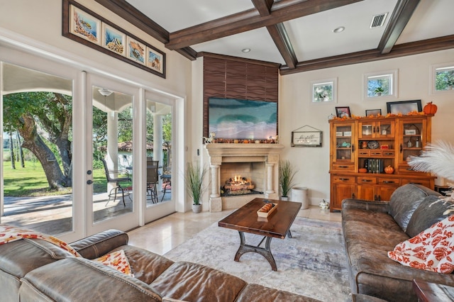 tiled living room featuring beam ceiling, a fireplace, a wealth of natural light, and coffered ceiling