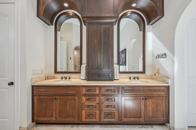 bathroom with tile patterned floors and vanity