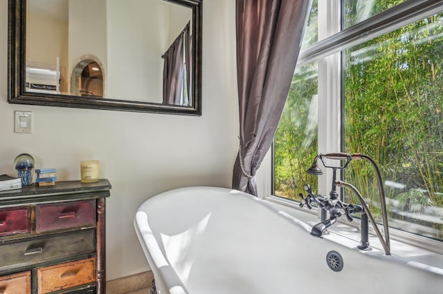 bathroom featuring a tub to relax in