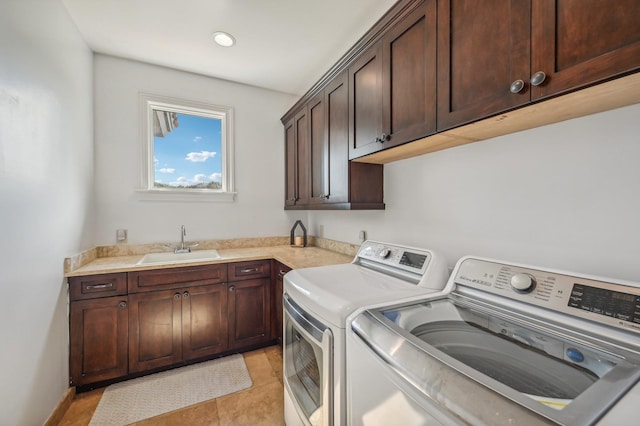 clothes washing area with cabinets, separate washer and dryer, sink, and light tile patterned floors