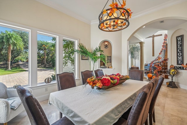 dining area with plenty of natural light, light tile patterned floors, crown molding, and an inviting chandelier