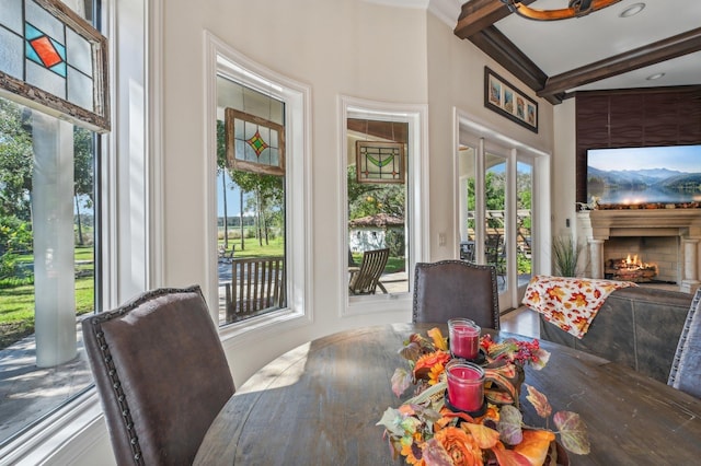 sunroom / solarium featuring french doors and beamed ceiling