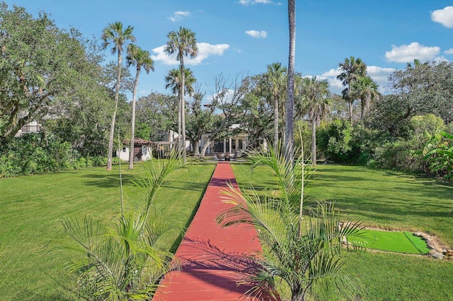 view of home's community featuring a lawn