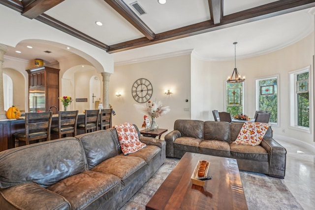 living room with an inviting chandelier, ornamental molding, light tile patterned floors, beam ceiling, and decorative columns