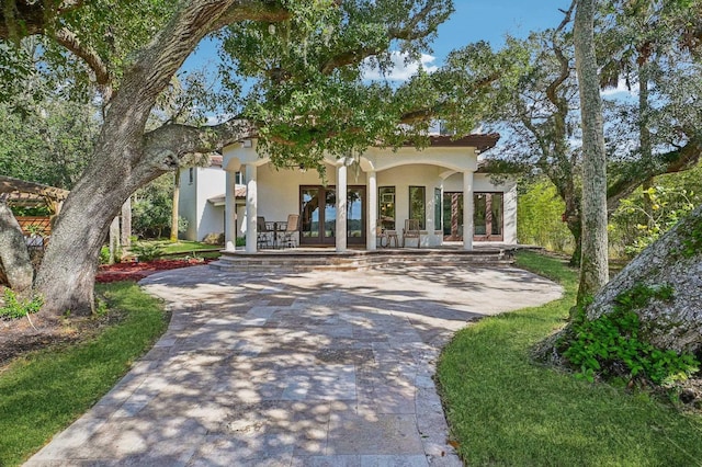 1332 Ponte Vedra Blvd, Ponte Vedra Beach, FL 32082 - view of front of home with driveway, stucco siding, and french doors