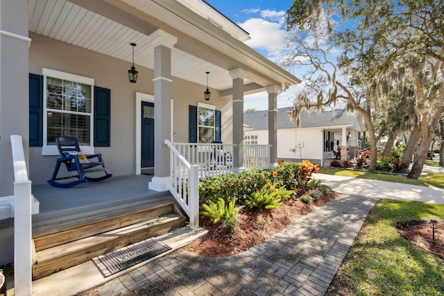 520 Weeping Willow Ln, Saint Augustine, FL 32080 - doorway to property with a porch and stucco siding
