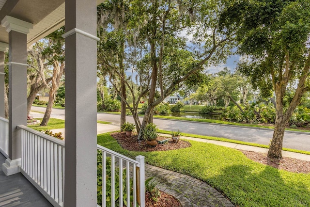 520 Weeping Willow Ln, Saint Augustine, FL 32080 - view of yard featuring covered porch and a water view