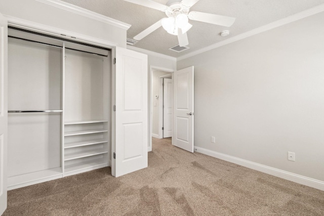 520 Weeping Willow Ln, Saint Augustine, FL 32080 - unfurnished bedroom with carpet flooring, crown molding, a closet, ceiling fan, and baseboards