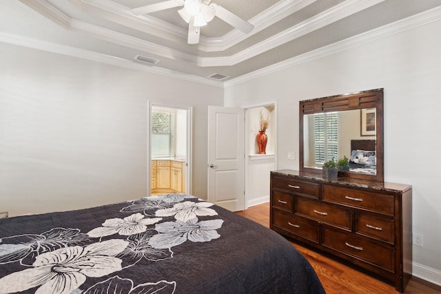 520 Weeping Willow Ln, Saint Augustine, FL 32080 - bedroom featuring dark wood finished floors, ornamental molding, a raised ceiling, a ceiling fan, and ensuite bath