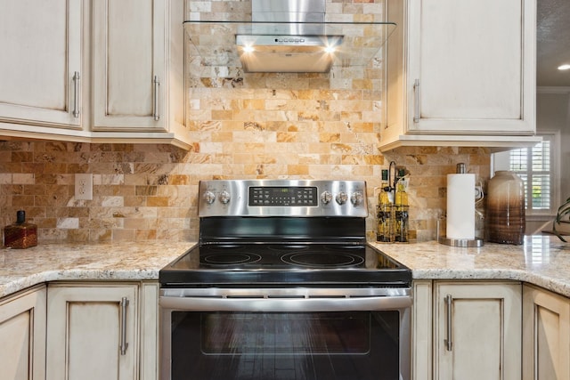 520 Weeping Willow Ln, Saint Augustine, FL 32080 - kitchen featuring stainless steel electric range oven, backsplash, and light stone counters