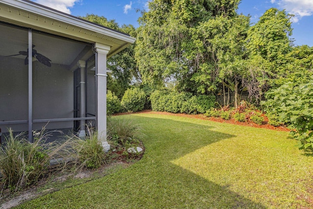 520 Weeping Willow Ln, Saint Augustine, FL 32080 - view of green lawn featuring a ceiling fan and a sunroom
