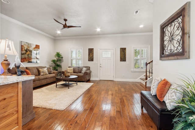 520 Weeping Willow Ln, Saint Augustine, FL 32080 - living area featuring a ceiling fan, stairs, dark wood-style floors, baseboards, and crown molding