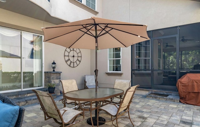 view of patio / terrace with a sunroom and area for grilling