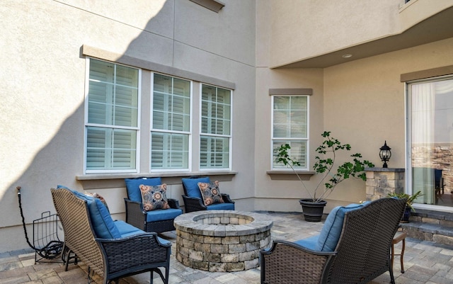 view of patio / terrace with a fire pit