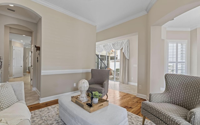 interior space with light hardwood / wood-style floors and ornamental molding