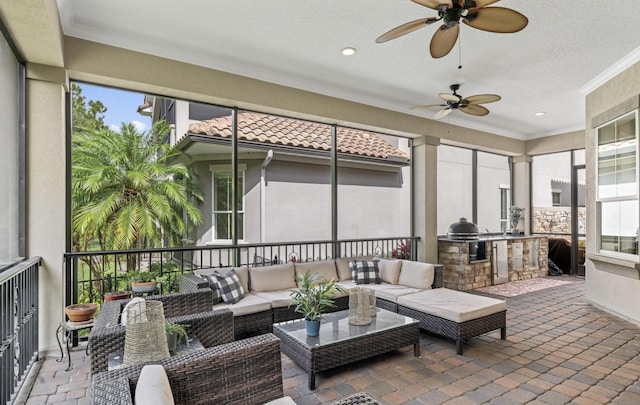 sunroom with ceiling fan and a healthy amount of sunlight