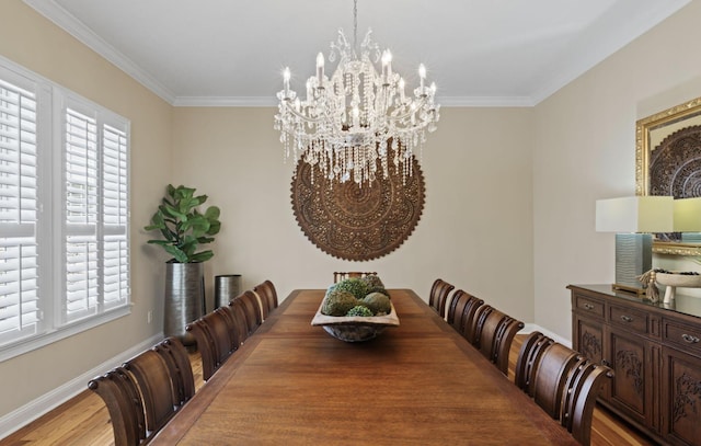 dining space featuring a chandelier, wood-type flooring, ornamental molding, and a healthy amount of sunlight