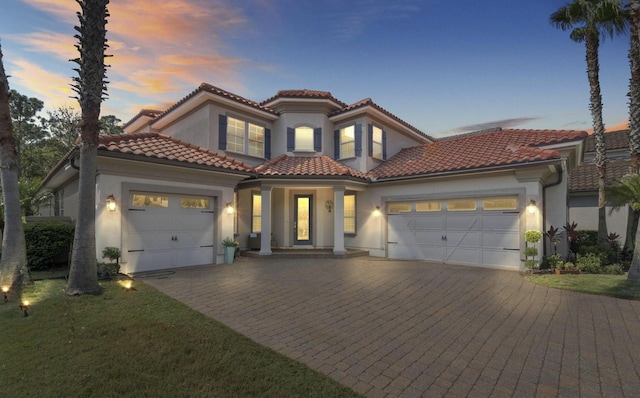 mediterranean / spanish-style house featuring a garage