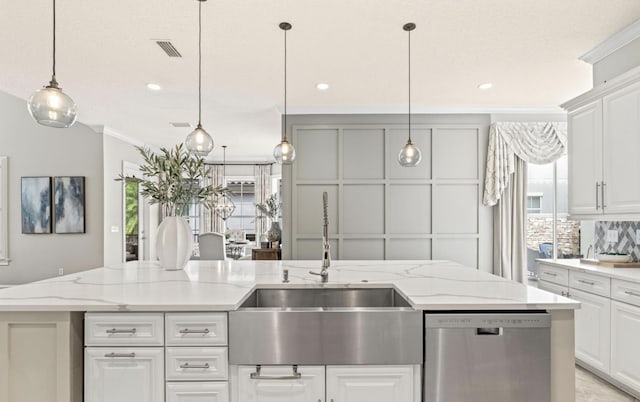 kitchen with dishwasher, light stone countertops, a center island with sink, and hanging light fixtures