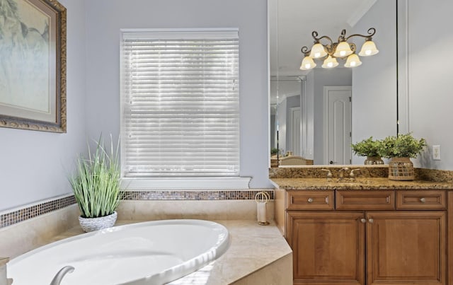 bathroom with tiled bath and vanity