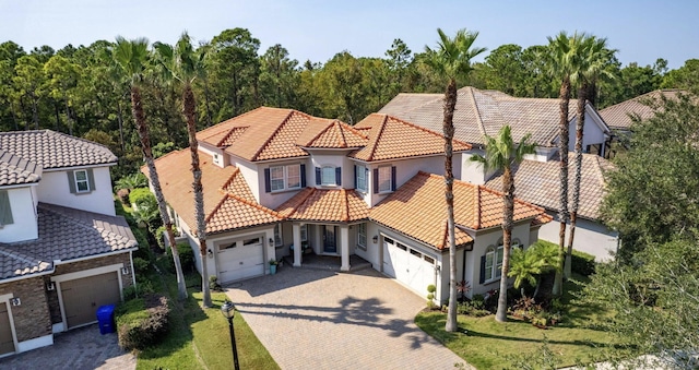 view of front of property with a front lawn and a garage