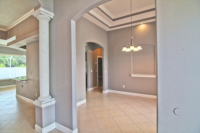 30 Fortress Pl, Palm Coast, FL 32137 - unfurnished dining area featuring arched walkways, light tile patterned floors, crown molding, a chandelier, and baseboards