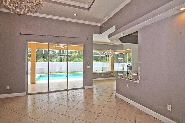 30 Fortress Pl, Palm Coast, FL 32137 - unfurnished room featuring crown molding, baseboards, tile patterned floors, recessed lighting, and a chandelier