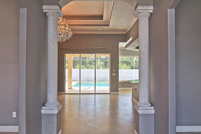 30 Fortress Pl, Palm Coast, FL 32137 - entryway with tile patterned floors, decorative columns, ornamental molding, baseboards, and arched walkways