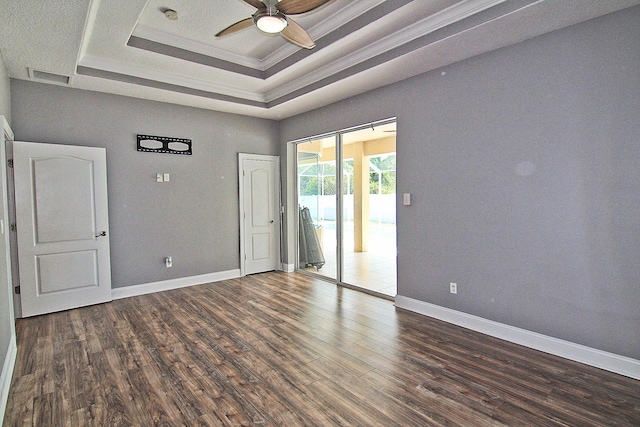 30 Fortress Pl, Palm Coast, FL 32137 - spare room featuring a ceiling fan, wood finished floors, a raised ceiling, ornamental molding, and baseboards