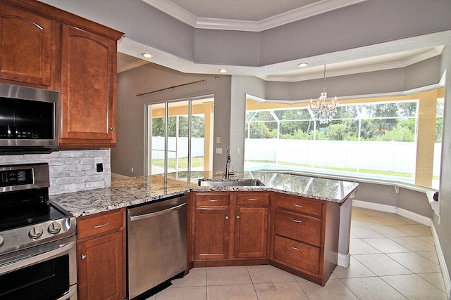 30 Fortress Pl, Palm Coast, FL 32137 - kitchen featuring appliances with stainless steel finishes, a sink, ornamental molding, light stone countertops, and light tile patterned flooring