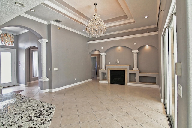 30 Fortress Pl, Palm Coast, FL 32137 - unfurnished living room with a chandelier, arched walkways, light tile patterned floors, baseboards, and a fireplace