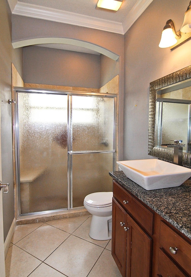 30 Fortress Pl, Palm Coast, FL 32137 - full bathroom with crown molding, vanity, a stall shower, toilet, and tile patterned flooring